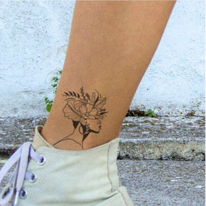 Woman in profile with flower crown temporary tattoo - 1 | Temporalis