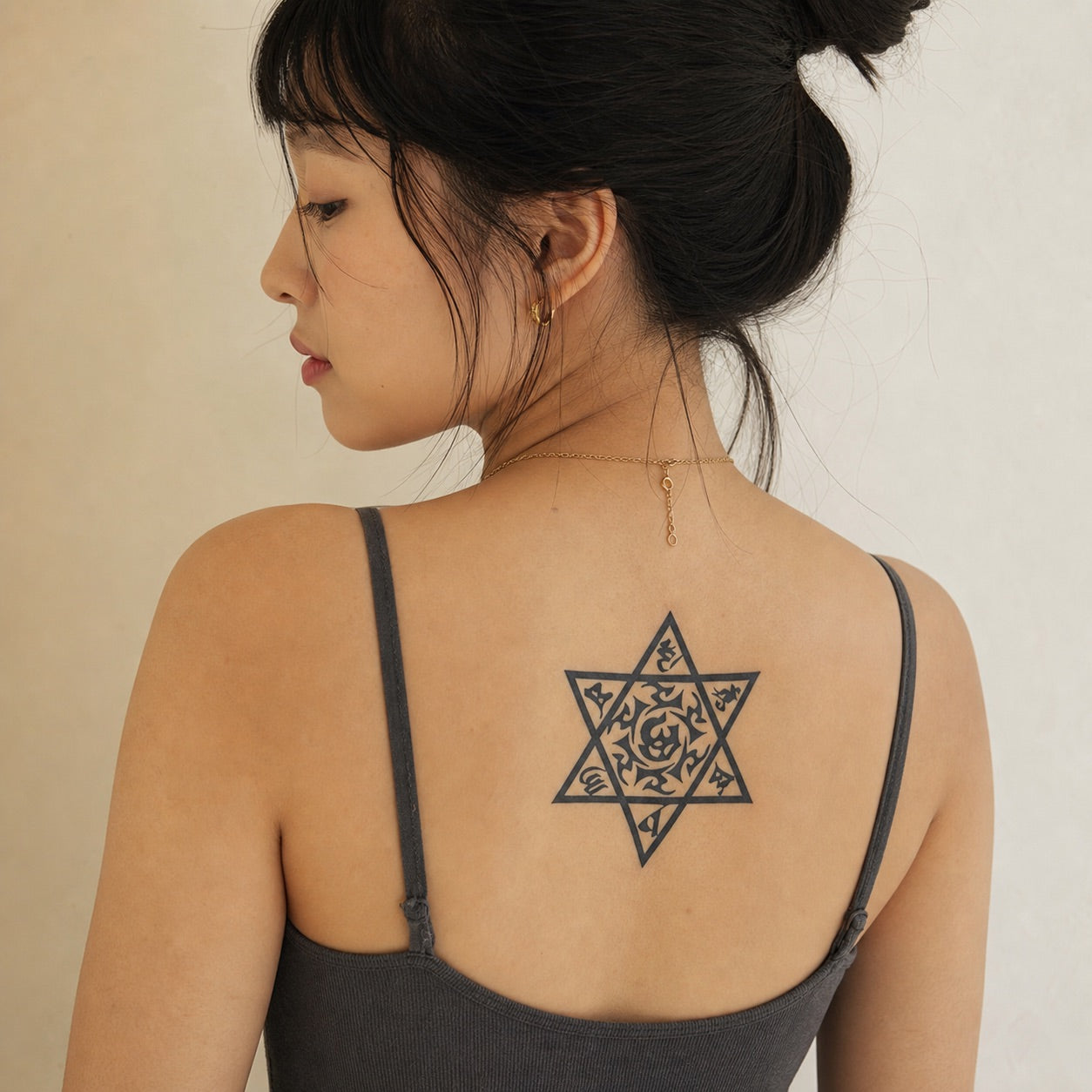 Mystic Star of David temporary tattoo set with tribal script fill and swirl center, one large and two small stars, blackwork on white background.