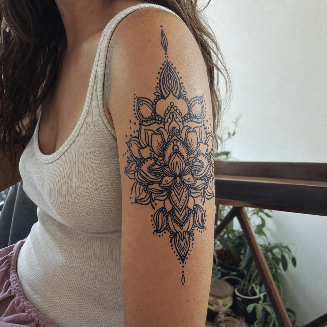 Vertical ornamental lotus mandala tattoo — spine format in blue-black ink